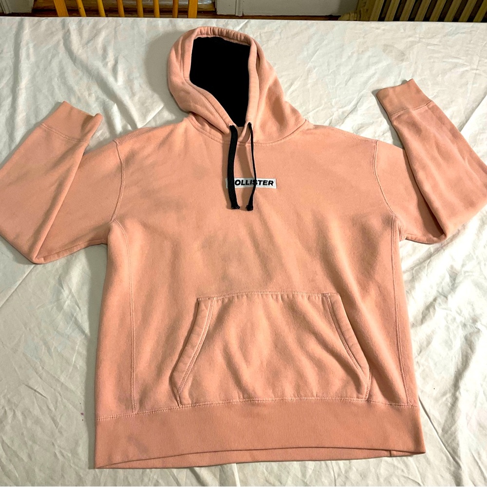 Hollister, size large woman’s, pink color, and black.